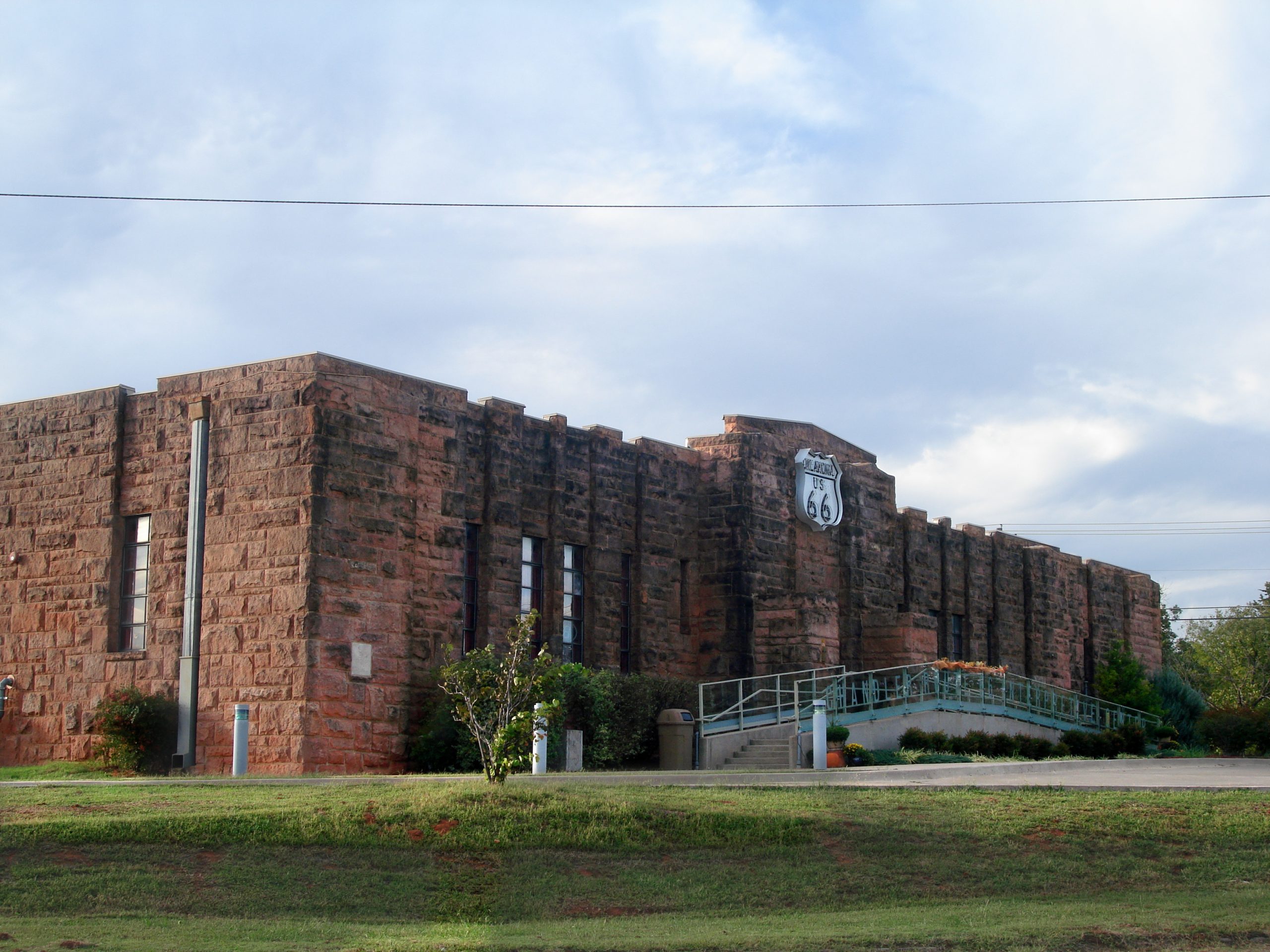 Chandler Armory sandstone facade with Oklahoma US 66 shield